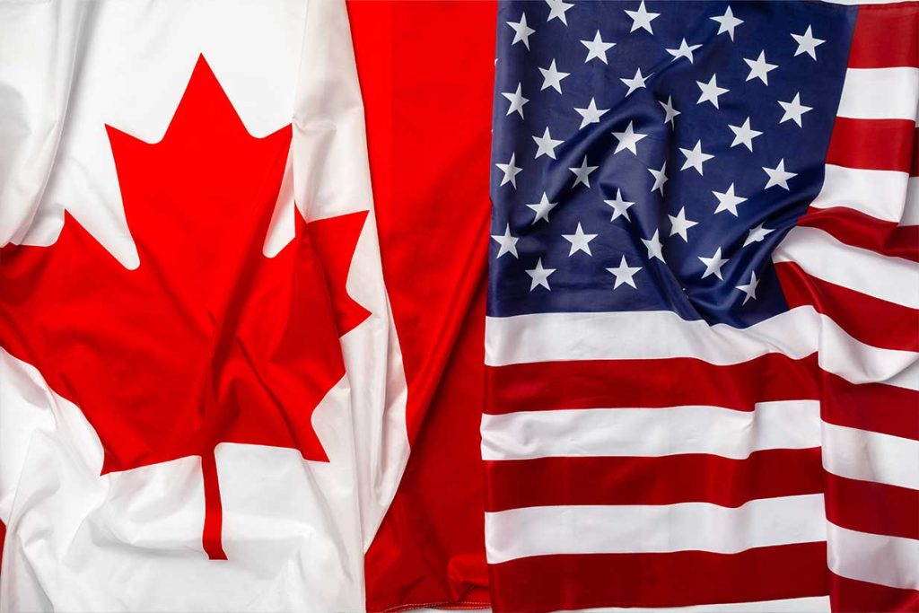 Estudiante comparando Estados Unidos y Canadá como destinos para estudiar en el extranjero.